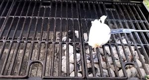 why do you use an onion to clean a grill